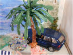 Beach Scene by Grace Car under palm tree