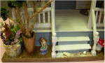Close-up of the front steps on the left. Notice the little mermaid.