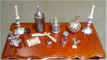 Close-up of dressing table with scissors, comb, shaving implements.