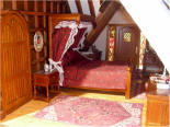 Third floor right corner bedroom, notice the dressed cat photo next to the bed. 