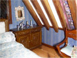 A close up of the dressing table and the embroidered mirror frame