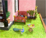 View of the right end of the house. Peacock & birds by Mini Gems. 
